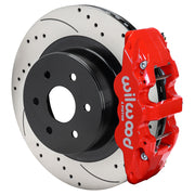Wilwood AERO4 rear brake assembly with red caliper and drilled-and-slotted rotors