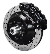 Wilwood Forged Narrow Superlite 6R front brake assembly with black caliper and drilled-and-slotted rotors
