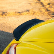 Rennline Carbon Fiber Upkick Spoiler: Elevate your 987 Cayman with this sleek, hand-laid carbon fiber spoiler for an OEM+ look. Shop now at PMB Performance.