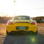 Rennline Carbon Fiber Upkick Spoiler: Elevate your 987 Cayman with this sleek, hand-laid carbon fiber spoiler for an OEM+ look. Shop now at PMB Performance.
