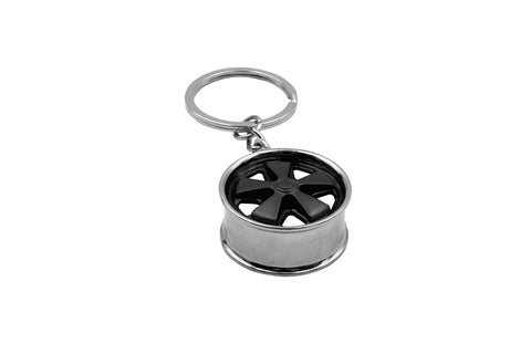 Get stylish with the Black Fuchs Key Chain, an essential accessory for every car lover! This chic keychain adds a touch of elegance to your keys while showcasing your passion for classic design. Make a statement and be the envy of your friends and family with this must-have accessory—order yours now!